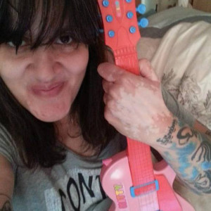 Dolly Sen with hello kitty guitar